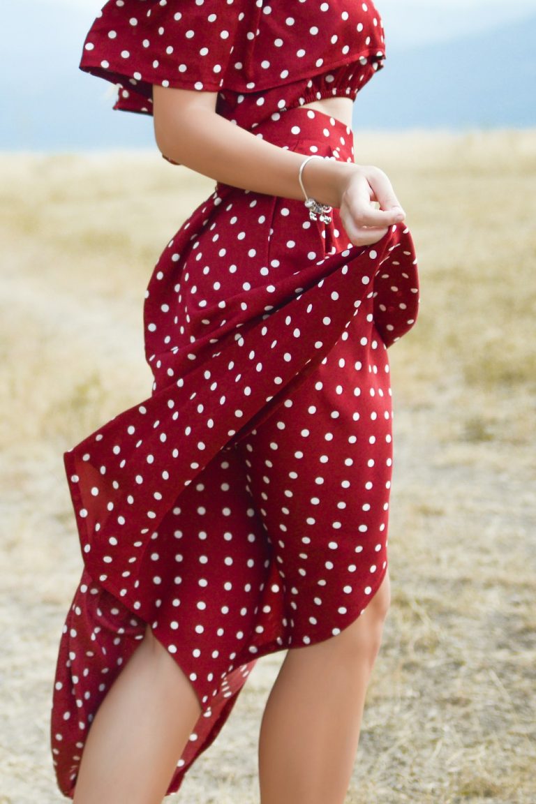 Woman in a red polka-dot summer dress