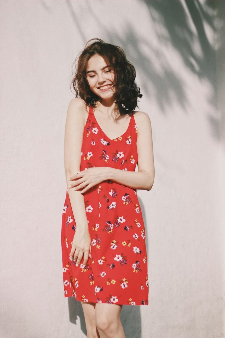 Woman in a red travel dress outdoors